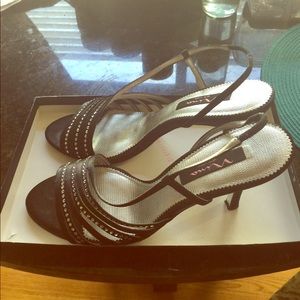 Black jewel embezzled open toe evening heels.